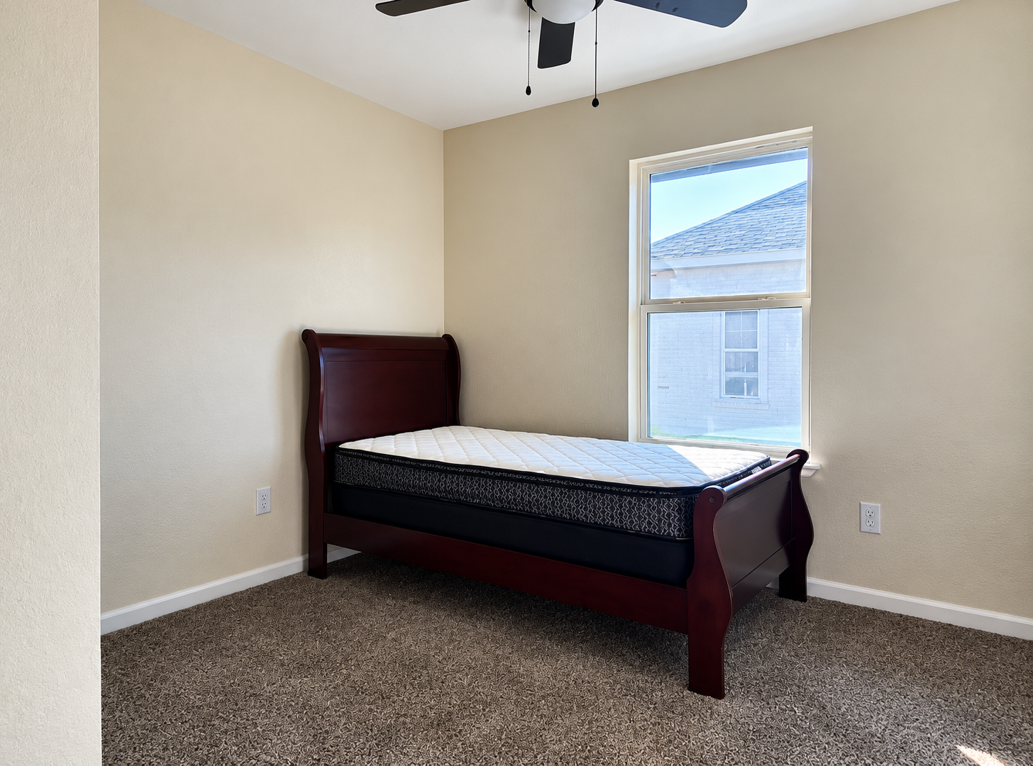 Simple Bedroom with Sleigh Bed and Window